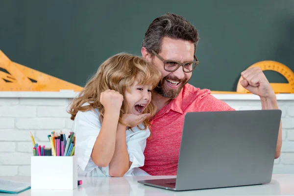 Pupil kid student and teacher tutor in classroom at school lesson. Education and knowledge