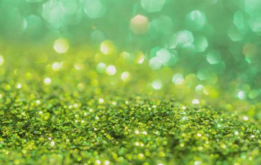 Bahar ışıltısı arka planı. Yeşil renkli ışıltılar. Soyut reklamcılık