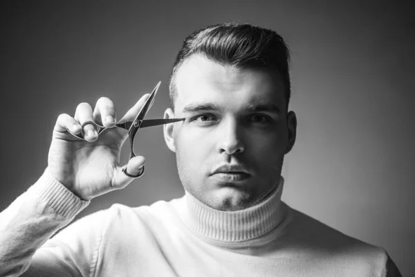 Barbershop service concept. Professional barber equipment. Cut hair. Man strict face hold scissors. Barber glossy hairstyle hold steel scissors. Create your style. Macho confident barber cut hair.