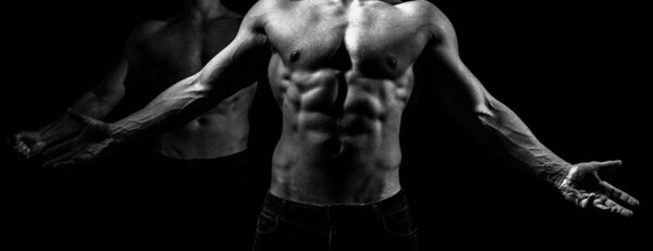 Мускулистый молодой человек в черной майке с прессом. Мужской пресс. Мышцы живота. Человек шесть
