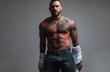 Improving his physique with testosterone. Strong hispanic man full of testosterone. Athletic latino man showing muscular body and six pack abs, testosterone concept. High testosterone level.