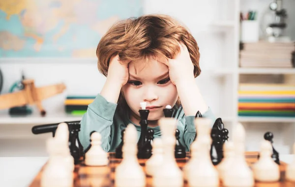 Boy think or plan about chess game, vintage style for education concept. Chess school. Boy kid playing chess at home