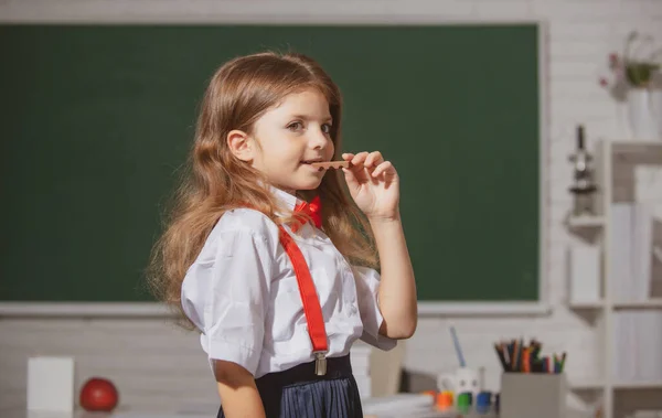 Portrait Cute Lovely Girl School Uniform Eating Chocolate Classroom Elementary — Stock Photo, Image