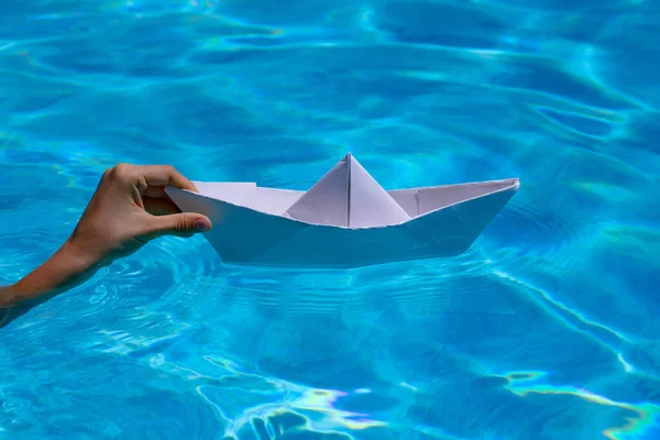Hand Holding Paper Boat Sea Background Paper Boat Hands Sea — Foto de Stock