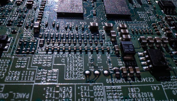 Electronic circuit board technology background. Electronic plate pattern. Circuit board, electrical scheme. Technology background. Electronic microcircuit with microchips and capacitors taken