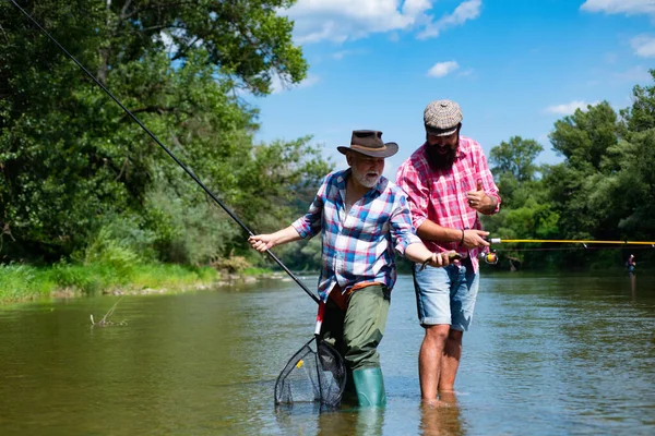 Young Old Fisherman Standing Shore Lake Fishing Rod Father Son — ストック写真