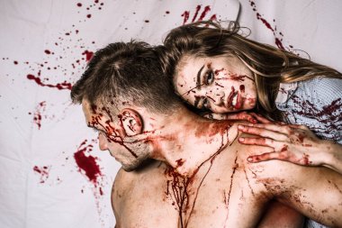 Couple in blood. Terrifying zombie couple. Fresh tasty beef. Zombie