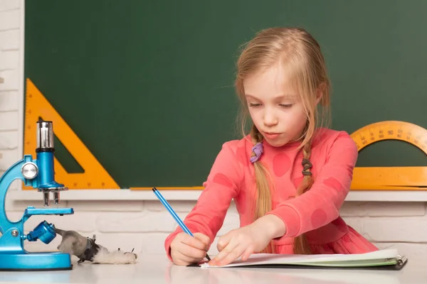 School Girl Writing Notepad Doing School Homework Thinking Child Siting — Stock Fotó