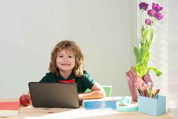 Boy student online learning, study online video call zoom. Happy learn english language online with laptop at home. Homeschooling