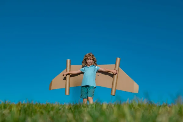 Child Boy Playing Cardboard Toy Airplane Wings Craft Sky Copy — ストック写真