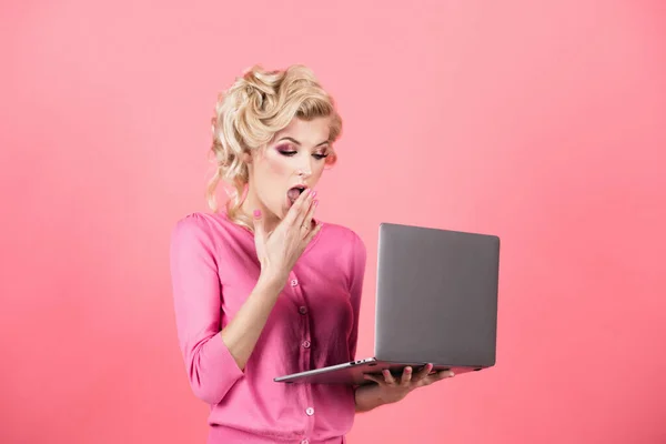 Surprised business woman face. Young business woman isolated on studio background. Woman with laptop pc computer