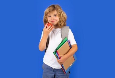 Learning knowledge and kids education concept. School teen boy in with backpack. Portrait of happy smiling school kid. Positive emotions