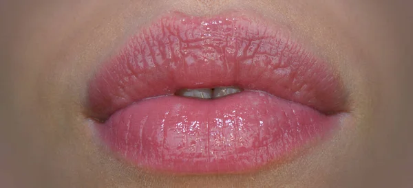 Filler injections, tender lips. Sensual female mouth. Close up glossy luxury mouth, glamour lip concept