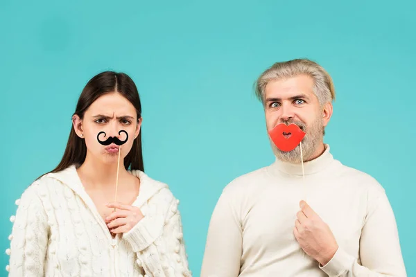 Gender concept. Identity transgender, gender stereotypes. Couple of woman with moustache and man with red lips. Gender equality