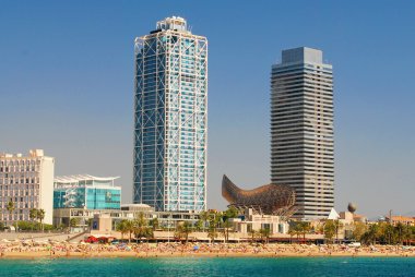 BARCELONA, SPAIN - AUGUST 12: Hotel Arts and Mapfre Tower and Pe clipart