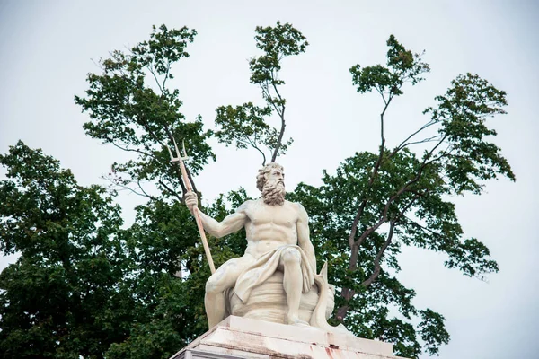 Statue Ancient God Neptune Trident Tree Background Green Leaves Patron — Stok fotoğraf