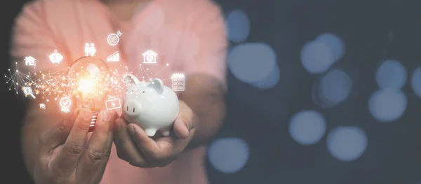 Man Holding Light Bulb White Piggy Bank Business Financial Icons — Stok Foto