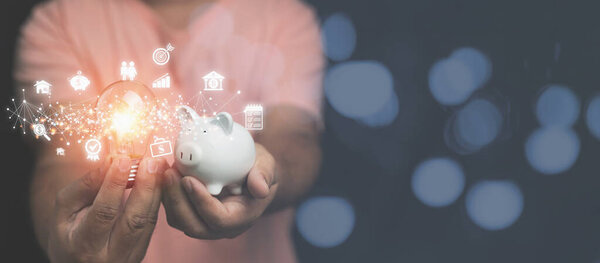 Man Holding Light Bulb White Piggy Bank Business Financial Icons Stock Image