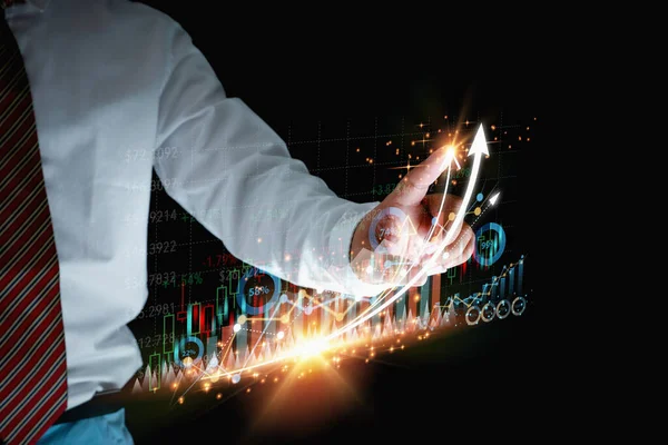 Businessman touching growth graph, and analyzing stock data on virtual screen. Price graph and indicator. Stock marketing investment. Development market and business investment.