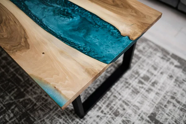new wooden table with epoxy resin on metal legs