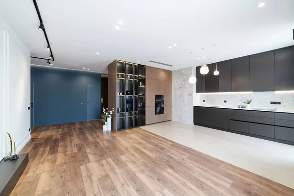 Modern interior design studio kitchen. Black loft-style kitchen