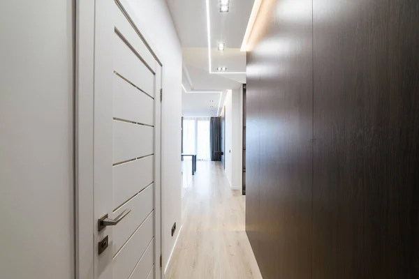 Large Corridor White Doors Dark Light Wall — стоковое фото