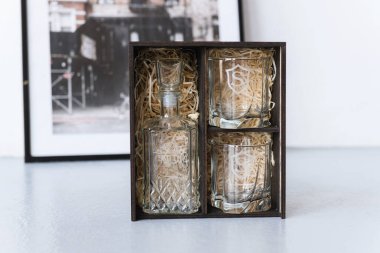 glass set for whiskey decanter and glasses in a wooden box
