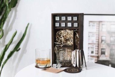 set for whiskey in a wooden box with stones and glasses