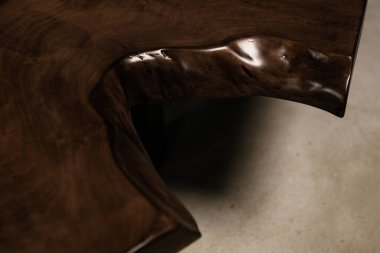 deep wood texture on a dark walnut rock table clipart