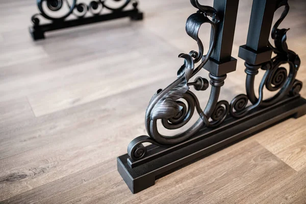 table made of wood and black epoxy resin on wrought metal legs