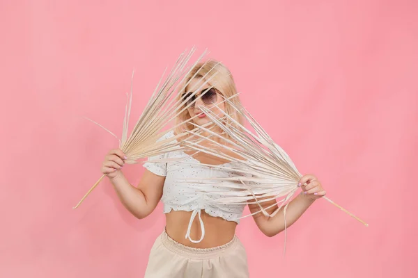 Girl Glasses Light Clothes Plant Her Hands Pink Background — Photo