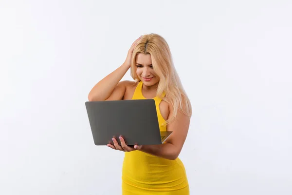 Young Girl Yellow Dress Laptop Her Hands Poses White Background — Zdjęcie stockowe