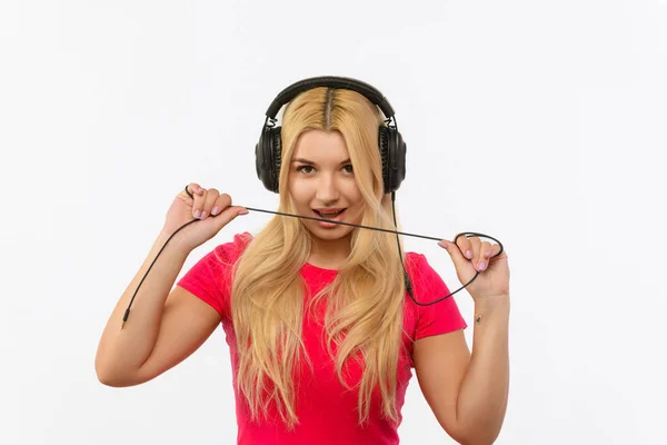 Girl Pink Dress White Background Bites Cord Headphones — Fotografia de Stock