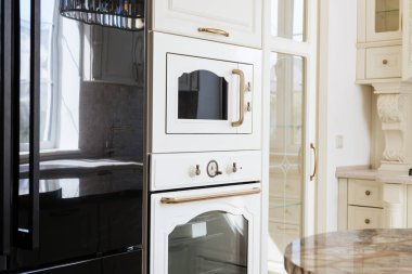 interior design of a modern and stylish bright kitchen in the house