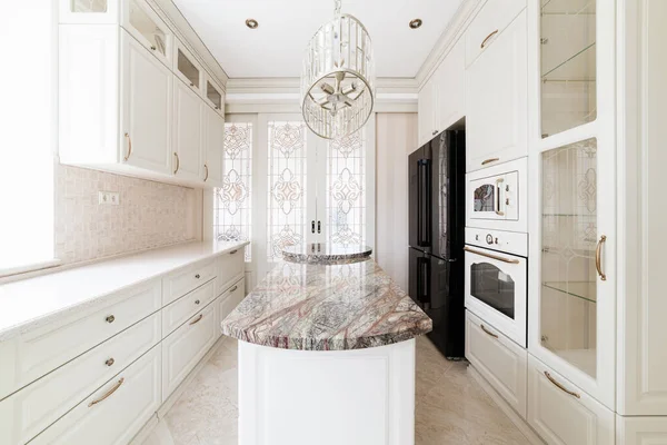 interior design of a modern and stylish bright kitchen in the house