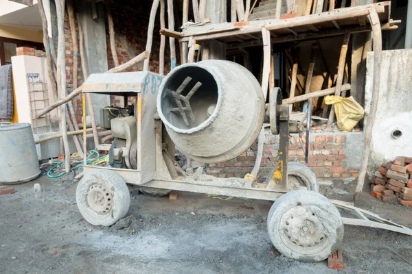 A diesel generator based concrete mixture machine in a construction site in Uttarakhand India.
