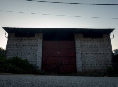 February 20th 2022. Uttarakhand India. A closed big warehouse with a large metal gate.