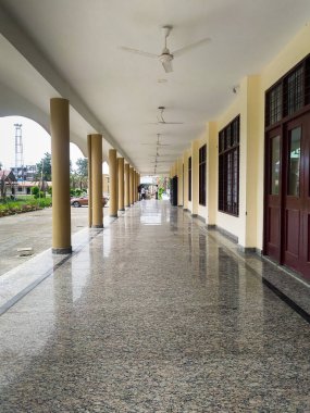 June 24th 2021 Dehradun India. A long modern open corridor with pillars of a large government building in India.