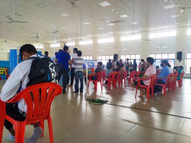 June 24th 2021 Dehradun India. Corona Virus Vaccination drive taking place with chairs and people maintaining social distancing.