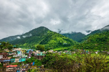 A wide angle shot of a village in the mountains of Lower Himalayan region of Uttarakhand State, India.