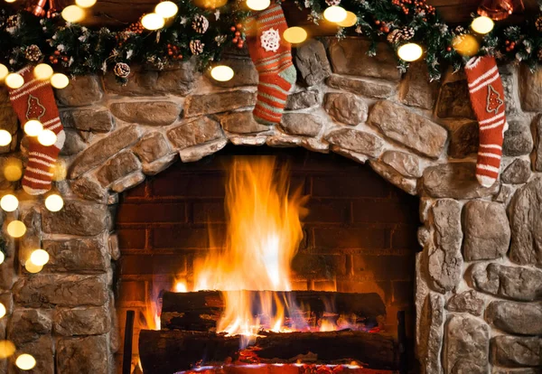 Interior decorated for Christmas. Fireplace with socks.