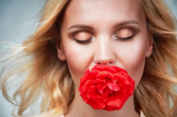 Sensual tender young woman portrait with breeze hair and rose in — Stock Photo, Image