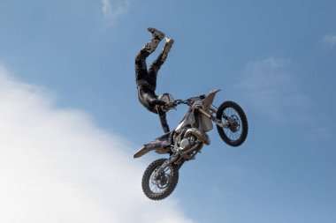 Bikers in flight. Motorcycles in the air. Motorcycle stunts. Motofreestyle stuntriding FMX show. Freestyle motocross mx. Harley Davidson BurgerFest in Prague , Czech Republic September 3 2022