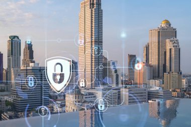 Güneydoğu Asya, Bangkok 'un günbatımı panoramik şehir manzarasında Padlock' un hologramı. Siber güvenlik istihbaratı kavramı. Çoklu pozlama.