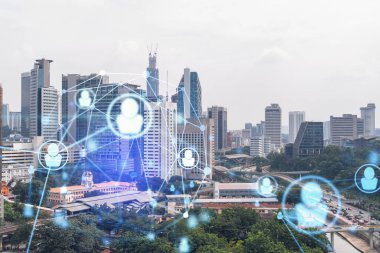 Sosyal medya, Kuala Lumpur, Malezya, Asya 'nın panorama şehri görüntüsü üzerine hologramı simgeliyor. Halkla ilişkiler, bağlantılar ve kariyer fırsatları kavramı. Çift pozlama.
