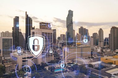 Güneydoğu Asya, Bangkok 'un günbatımı panoramik şehir manzarasında Padlock' un hologramı. Siber güvenlik istihbaratı kavramı. Çoklu pozlama.