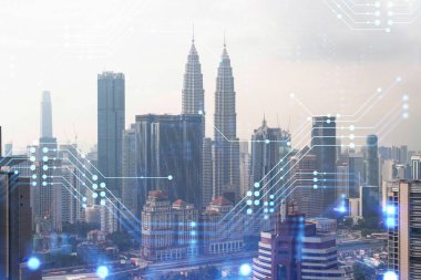 Kuala Lumpur 'un Panorama şehri manzarası üzerinde teknoloji hologramı. KL, Asya 'nın Malezya' daki en büyük teknoloji merkezidir. Kodlama ve yüksek teknoloji geliştirme kavramı. Çift pozlama.