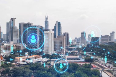 Sosyal medya, Kuala Lumpur, Malezya, Asya 'nın panorama şehri görüntüsü üzerine hologramı simgeliyor. Halkla ilişkiler, bağlantılar ve kariyer fırsatları kavramı. Çift pozlama.