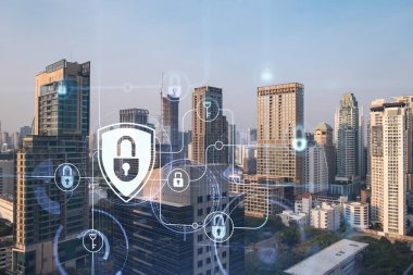 Güneydoğu Asya, Bangkok 'un günbatımı panoramik şehir manzarasında Padlock' un hologramı. Siber güvenlik istihbaratı kavramı. Çoklu pozlama.