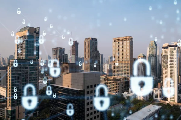 Güneydoğu Asya, Bangkok 'un günbatımı panoramik şehir manzarasında Padlock' un hologramı. Siber güvenlik istihbaratı kavramı. Çoklu pozlama.